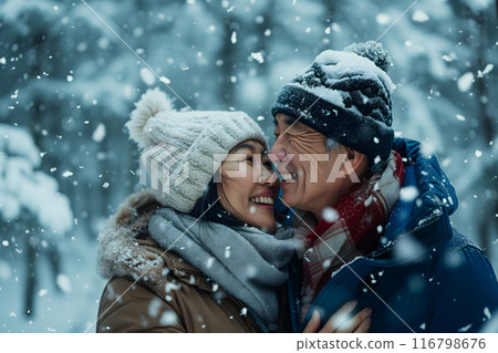 Senior heterosexual Asian couple in beautiful snowy winter nature 116798676