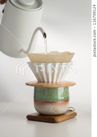 Precision pour-over coffee brew, artisanal craft. Precision pour-over coffee brew, artisanal craft. 116799124