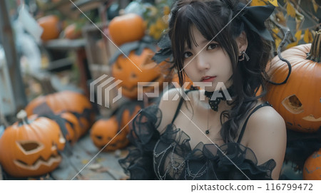 Japanese woman in a black dress cosplaying for Halloween Japanese woman in a black dress cosplaying for Halloween 116799472