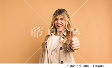 Enthusiastic transgender woman with clenched fists celebrating victory Enthusiastic transgender woman with clenched fists celebrating victory 116800998