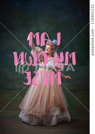 Emotional young woman in vintage dress making motivational quotation i am my own muse against dark textured green background Emotional young woman in vintage dress making motivational quotation i am my own muse against dark textured green background 116801232