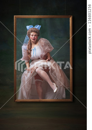 Historical exhibition. Romantic young woman in period attire appearing for picture frame against vintage green background Historical exhibition. Romantic young woman in period attire appearing for picture frame against vintage green background 116801256