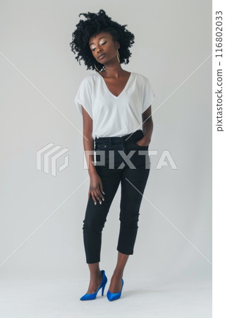 Young stylish woman posing wearing jeans and white t shirt 116802033
