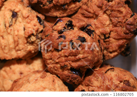 Homemade oat cookies with raisins and cranberries Homemade oat cookies with raisins and cranberries 116802705