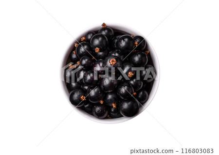 Ripe blackcurrant berries in droplets of water in a ceramic bowl Ripe blackcurrant berries in droplets of water in a ceramic bowl 116803083