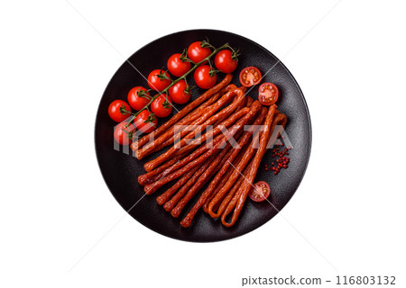 Mini sausages or cabanosi smoked with salt and spices 116803132