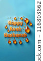 Rosh Hashanah holiday concept - letters spelled from honey with drips, light background, top view 116803662