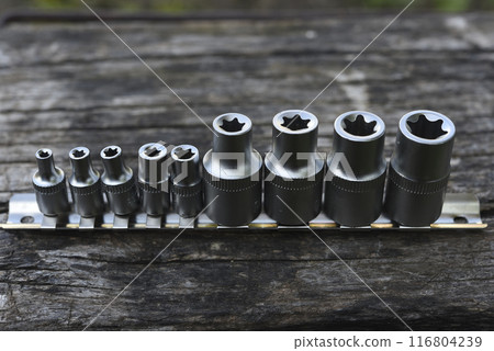 A set of end heads and nozzles. Chrome keys. Tools. A set of end heads and nozzles. Chrome keys. Tools. 116804239