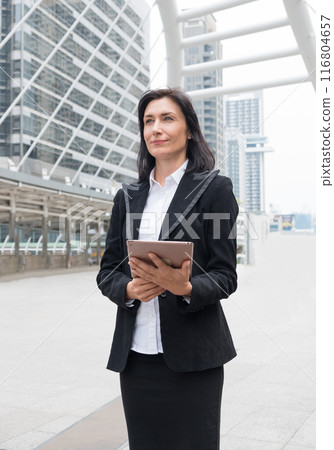 Businesswoman leader are stand holding laptop with commitment 116804657