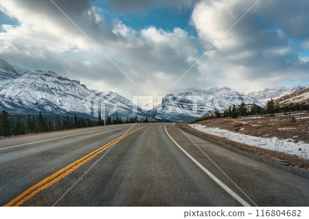 Road trip driving on highway road with rocky mountains in winter at Kootenay plains area 116804682