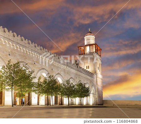 King Hussein Bin Talal mosque in Amman (at night), Jordan. Against the background of a beautiful sky with clouds King Hussein Bin Talal mosque in Amman (at night), Jordan. Against the background of a beautiful sky with clouds 116804868