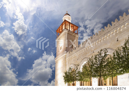 King Hussein Bin Talal mosque in Amman (at night), Jordan. Against the background of a beautiful sky with clouds King Hussein Bin Talal mosque in Amman (at night), Jordan. Against the background of a beautiful sky with clouds 116804874