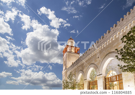 King Hussein Bin Talal mosque in Amman (at night), Jordan. Against the background of a beautiful sky with clouds King Hussein Bin Talal mosque in Amman (at night), Jordan. Against the background of a beautiful sky with clouds 116804885