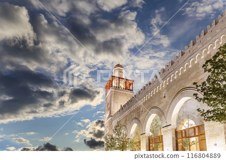 King Hussein Bin Talal mosque in Amman (at night), Jordan. Against the background of a beautiful sky with clouds King Hussein Bin Talal mosque in Amman (at night), Jordan. Against the background of a beautiful sky with clouds 116804889