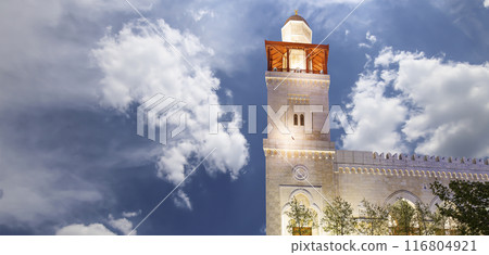 King Hussein Bin Talal mosque in Amman (at night), Jordan.  Against the background of a beautiful sky with clouds 116804921
