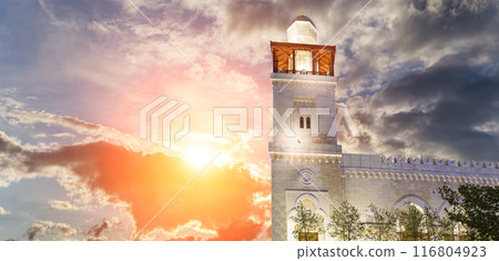 King Hussein Bin Talal mosque in Amman (at night), Jordan.  Against the background of a beautiful sky with clouds 116804923