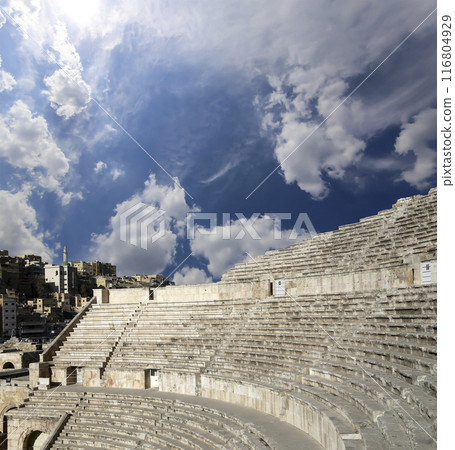 Roman Theatre in Amman, Jordan -- theatre was built the reign of Antonius Pius (138-161 CE), the large and steeply raked structure could seat about 6000 people. Against the sky with clouds 116804929