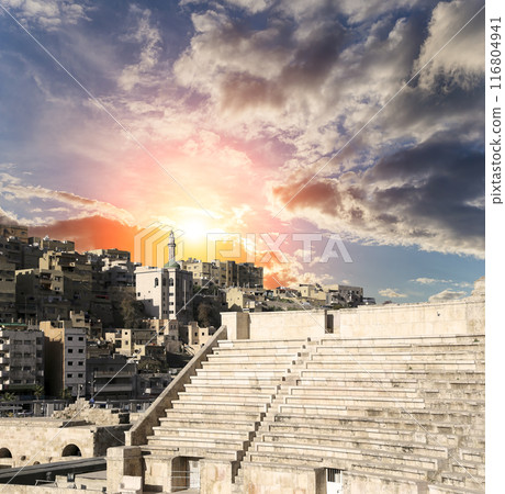 Roman Theatre in Amman, Jordan -- theatre was built the reign of Antonius Pius (138-161 CE), the large and steeply raked structure could seat about 6000 people. Against the sky with clouds 116804941