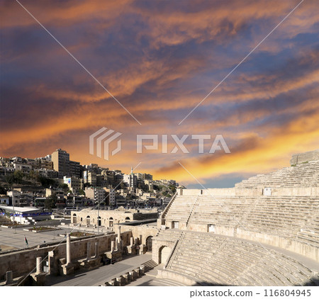 Roman Theatre in Amman, Jordan -- theatre was built the reign of Antonius Pius (138-161 CE), the large and steeply raked structure could seat about 6000 people. Against the sky with clouds 116804945