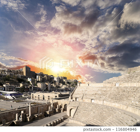Roman Theatre in Amman, Jordan -- theatre was built the reign of Antonius Pius (138-161 CE), the large and steeply raked structure could seat about 6000 people. Against the sky with clouds 116804946