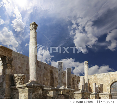 Roman Theatre in Amman, Jordan -- theatre was built the reign of Antonius Pius (138-161 CE), the large and steeply raked structure could seat about 6000 people. Against the sky with clouds Roman Theatre in Amman, Jordan -- theatre was built the reign of Antonius Pius (138-161 CE), the large and steeply raked structure could seat about 6000 people. Against the sky with clouds 116804973