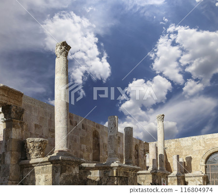 Roman Theatre in Amman, Jordan -- theatre was built the reign of Antonius Pius (138-161 CE), the large and steeply raked structure could seat about 6000 people. Against the sky with clouds Roman Theatre in Amman, Jordan -- theatre was built the reign of Antonius Pius (138-161 CE), the large and steeply raked structure could seat about 6000 people. Against the sky with clouds 116804974