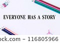EVERYONE HAS A STORY text on white background and with pencils.The image shows a slogan Everyone Has a Story written on a white sheet. Bright picture. Concept Image 116805966