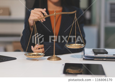 Judge gavel with Justice lawyers having team meeting at law firm background. Concepts of Law and Legal services. Judge gavel with Justice lawyers having team meeting at law firm background. Concepts of Law and Legal services. 116806170