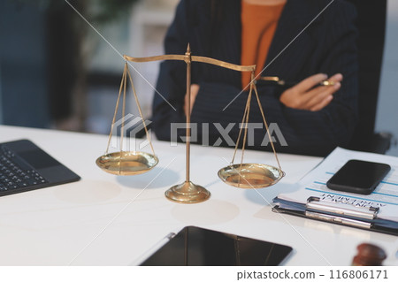 Judge gavel with Justice lawyers having team meeting at law firm background. Concepts of Law and Legal services. Judge gavel with Justice lawyers having team meeting at law firm background. Concepts of Law and Legal services. 116806171