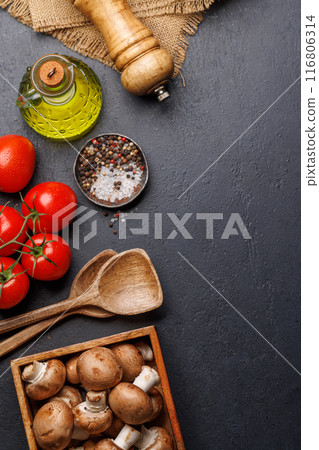 Spices, olive oil, and utensils on cooking table Spices, olive oil, and utensils on cooking table 116806314