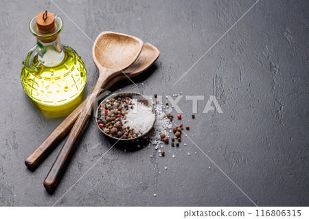 Spices, olive oil, and utensils on cooking table Spices, olive oil, and utensils on cooking table 116806315