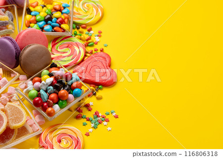 Various colorful candies, lollipops, and macaroons 116806318
