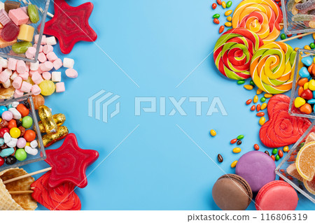 Various colorful candies, lollipops, and macaroons Various colorful candies, lollipops, and macaroons 116806319