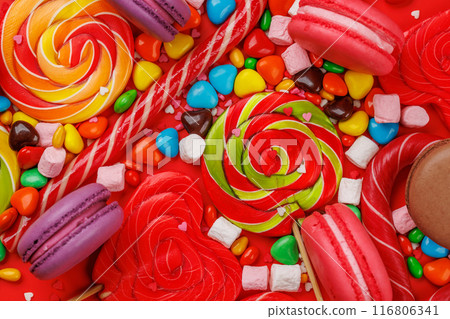 Various colorful candies, lollipops, and macaroons Various colorful candies, lollipops, and macaroons 116806341
