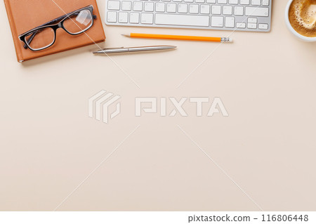 Office desk table with computer, cup of coffee and supplies 116806448