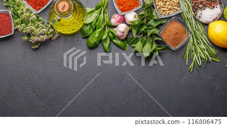 Various herbs and spices on the table 116806475