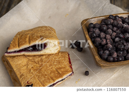 blueberry jam as a filling for a bun blueberry jam as a filling for a bun 116807550