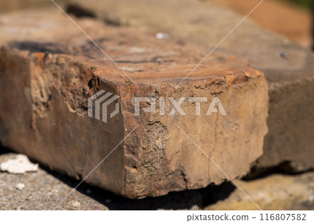 old used bricks made of red clay and other materials 116807582