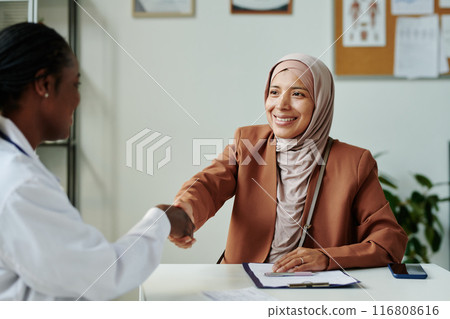 Patient and doctor shaking hands Patient and doctor shaking hands 116808616