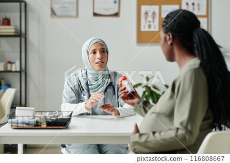 Consulting patient about new pills 116808667