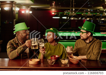 Clinking with glasses of beer by counter 116808703