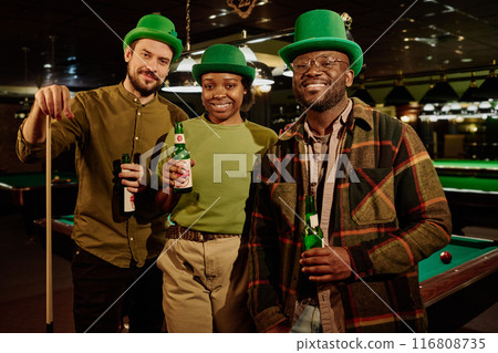 Happy friends holding bottles of beer 116808735