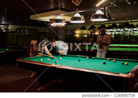 Man and woman playing billiards 116808759