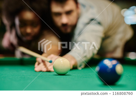 White billiard ball on wide green table 116808760