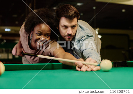 Couple with cue looking at white ball 116808761