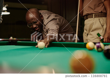 Player looking at ball before hitting 116808781