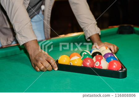 Touching rack surrounding colorful balls 116808806