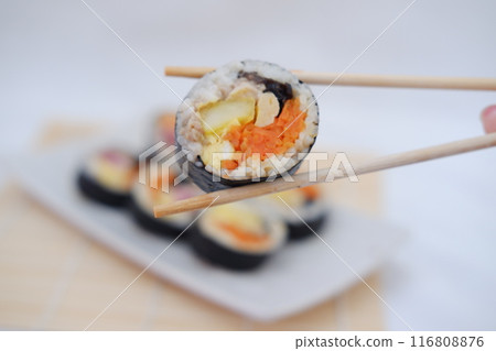Sushi rolls on a plate on a white background. Japanese food Sushi rolls on a plate on a white background. Japanese food 116808876