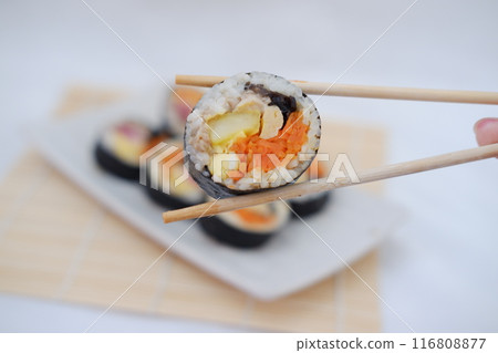 Sushi rolls on a plate on a white background. Japanese food Sushi rolls on a plate on a white background. Japanese food 116808877