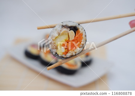 Sushi rolls on a plate on a white background. Japanese food Sushi rolls on a plate on a white background. Japanese food 116808878